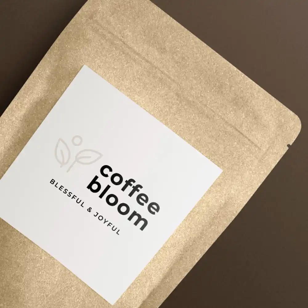 Product packaging design of a bag of coffee placed on a table.